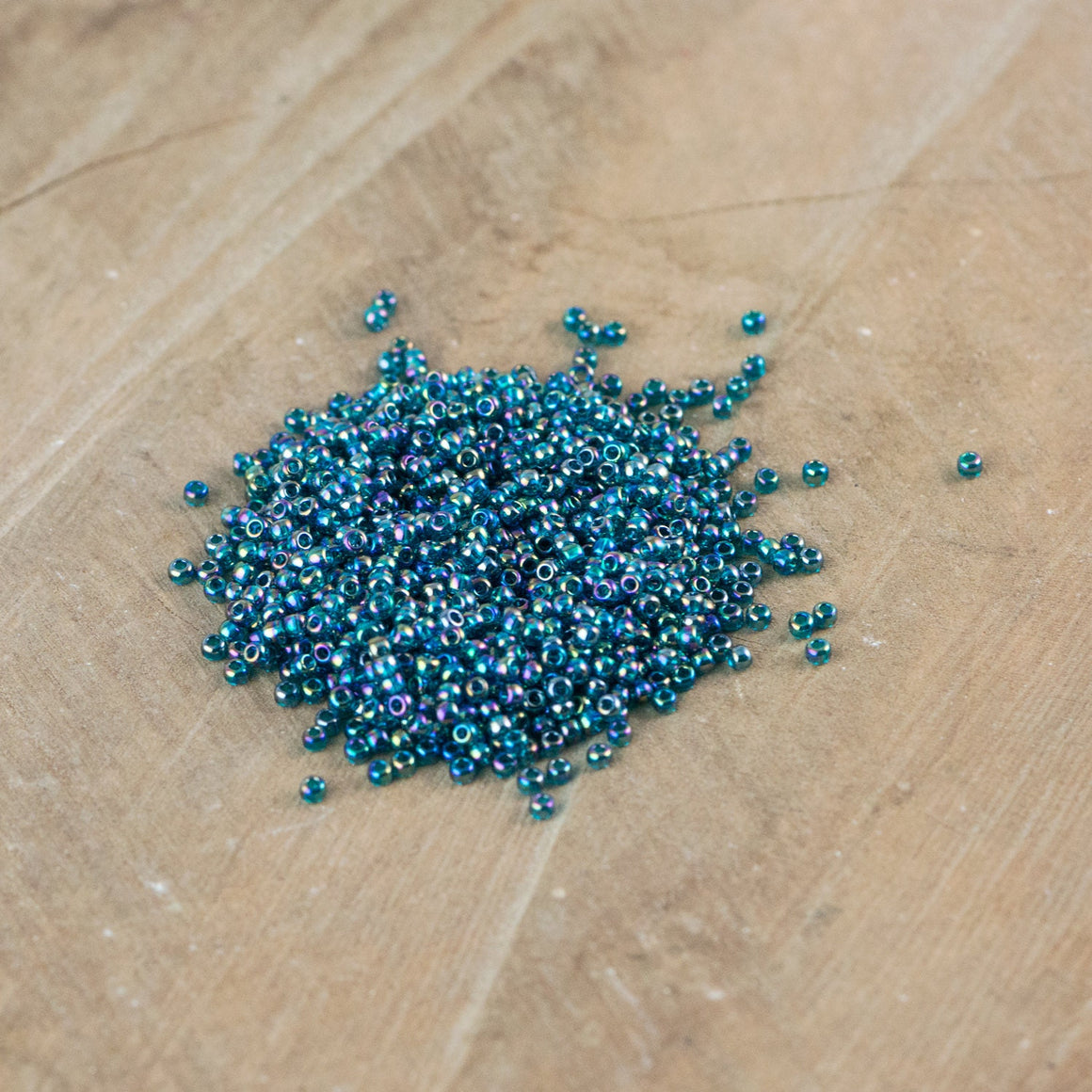 11/0 TOHO ROUND Transparent Rainbow Teal Seed Bead (8g)