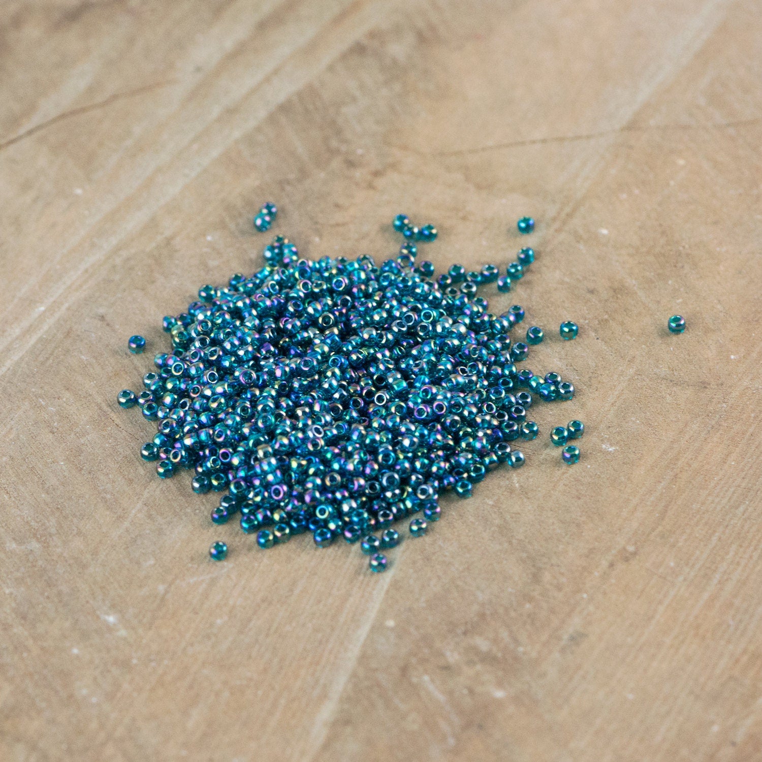 11/0 TOHO ROUND Transparent Rainbow Teal Seed Bead (8g)