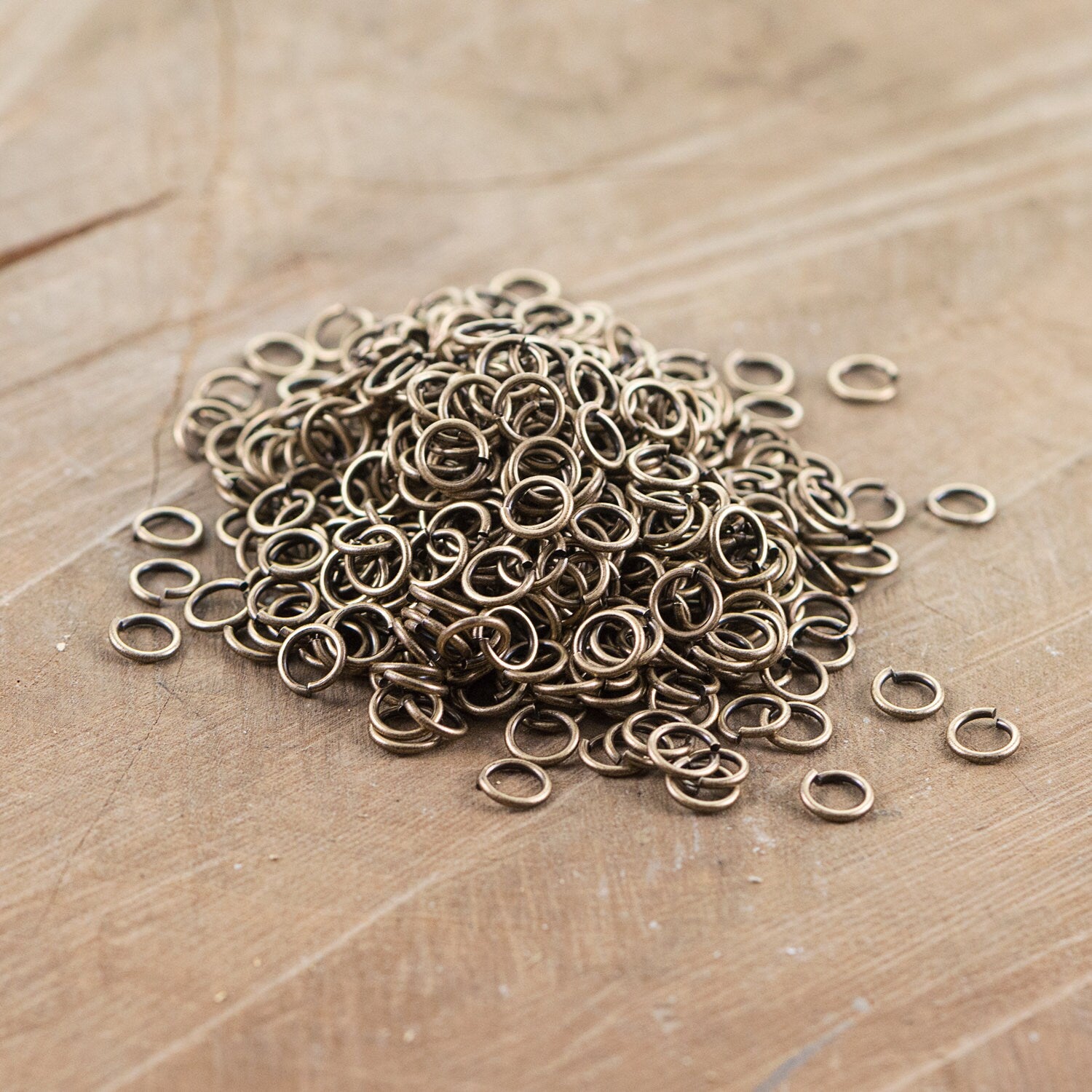 7mm OD Open Brass Ox Jump Rings 18 Gauge Made in the USA (100) fnd201B