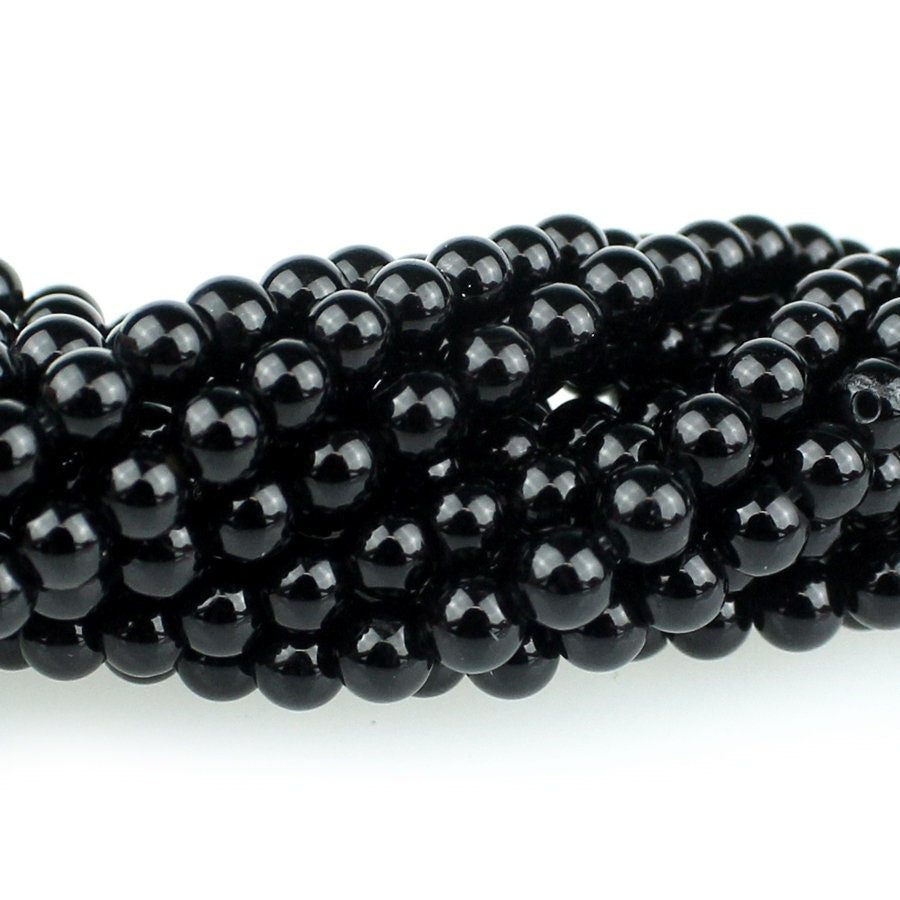 Dakota Stones Onyx 4mm Round Gemstones. 8" Strand. ONX4RD-8