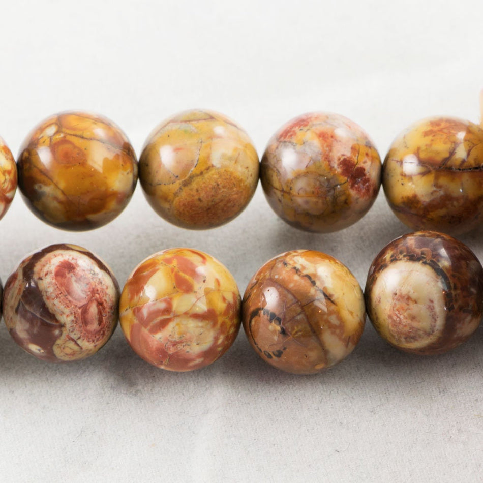 Dakota Stones Birdseye Rhyolite 12mm Round Gemstones. 8" Strand. BER12RD-8
