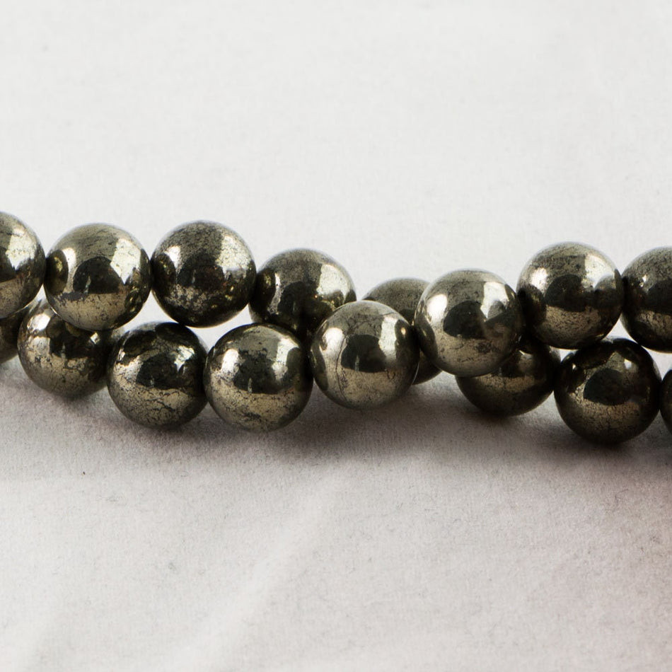 Dakota Stones Pyrite 8mm Round Beads Gemstones. 8" Strand. Pyr8RD-8