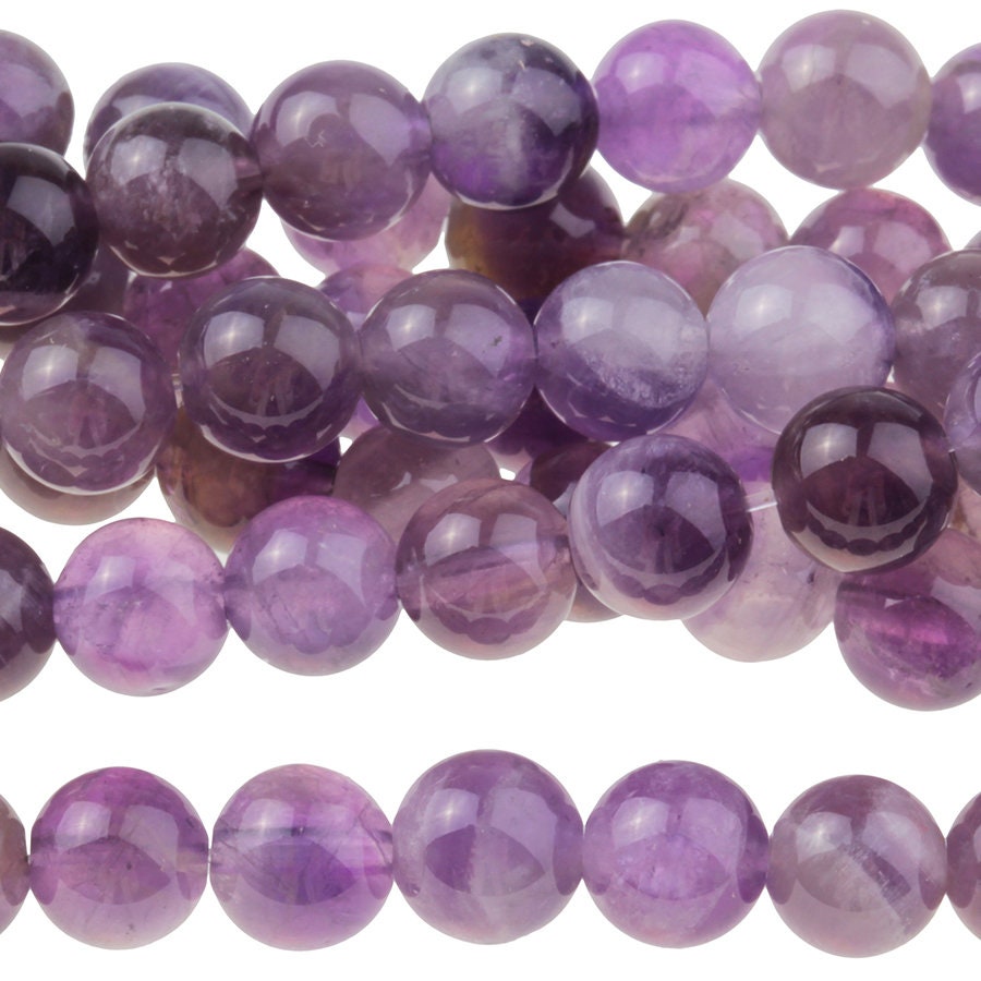Dakota Stones Dog Teeth Amethyst 6mm Round Gemstones. 8" Strand. DTA6RD-8