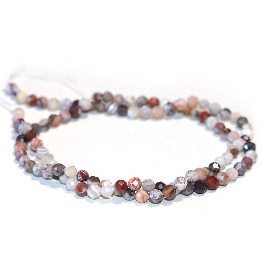 Dakota Stones Mexican Lace Laguna 4mm Diamond Cut Faceted Round Gemstones 16" Strand. MLA4RD-F-DC