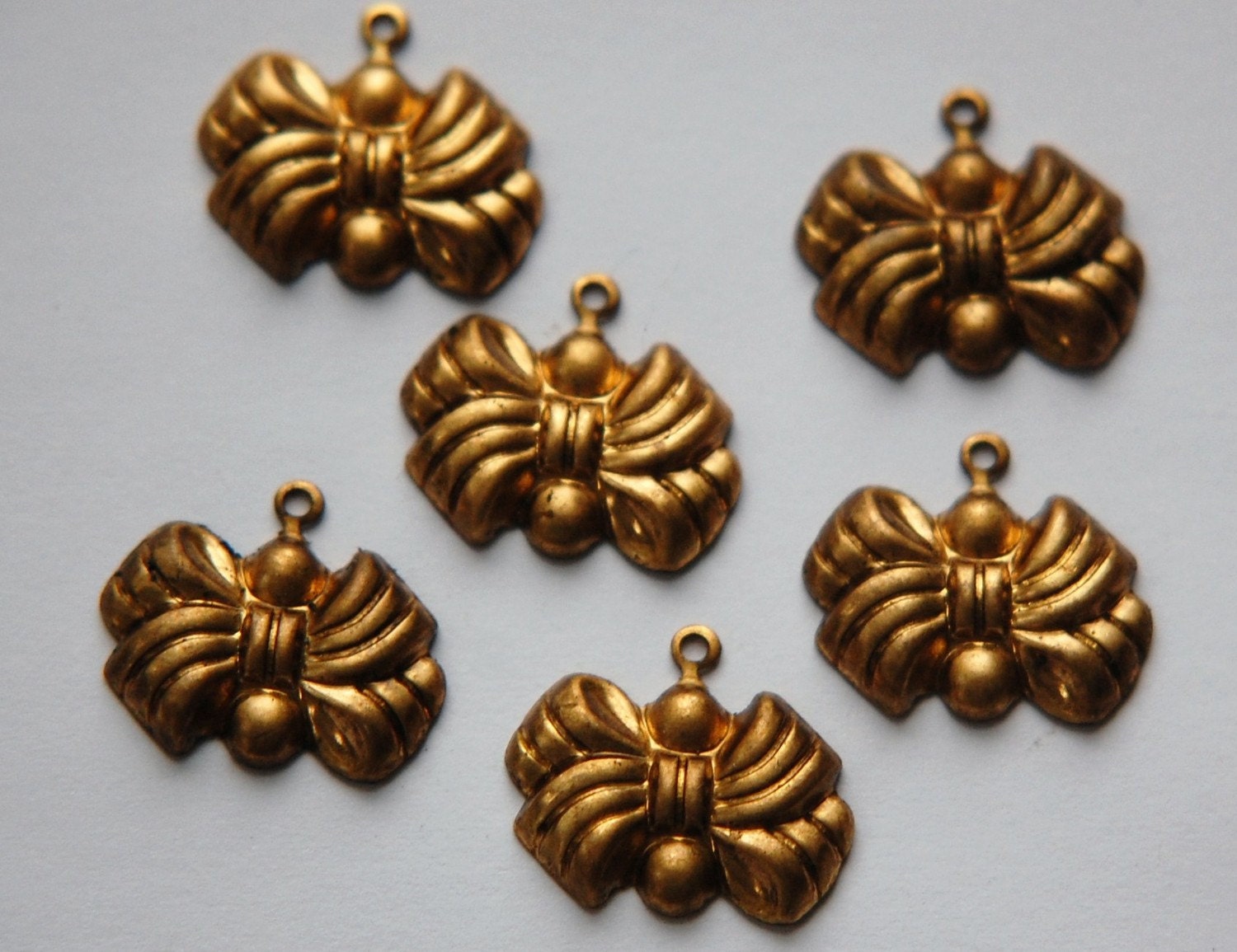 Raw Brass Puffy Bow Charm Drop chr003