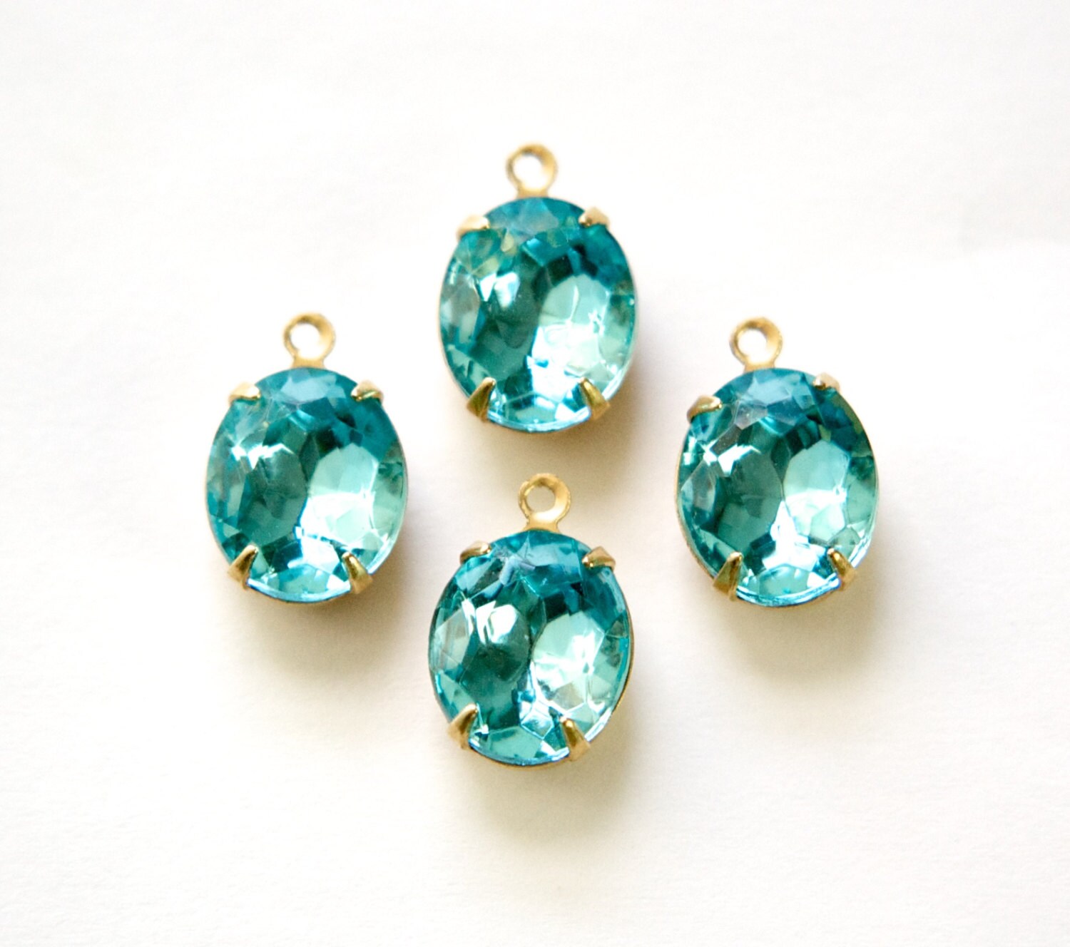 Aqua Blue Faceted Oval Stones in 1 Loop Brass Setting 12mmx10mm (4) ovl011L