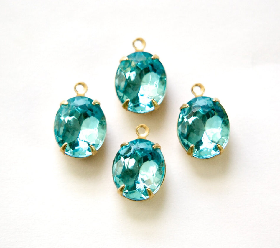 Aqua Blue Faceted Oval Stones in 1 Loop Brass Setting 12mmx10mm (4) ovl011L