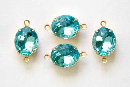 Aqua Blue Faceted Oval Glass Stones in 2 Loop Brass Setting ovl011L2