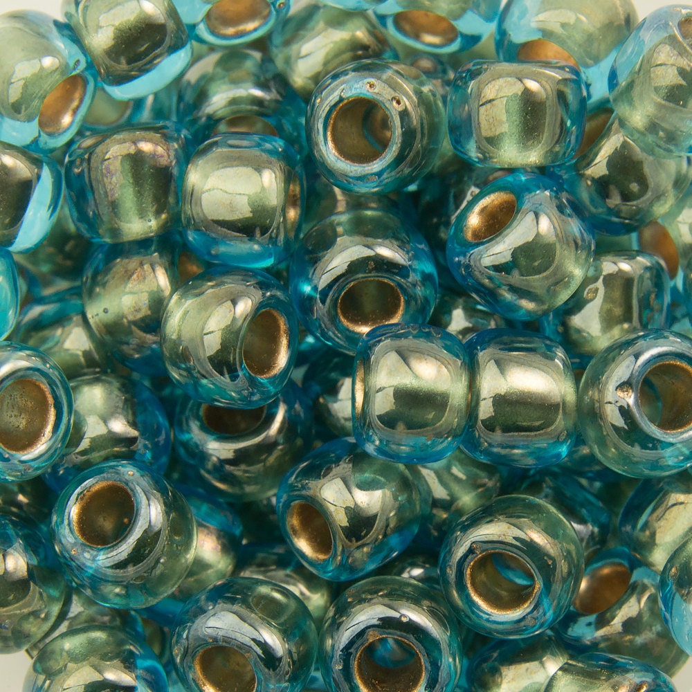 6/0 TOHO ROUND Gold Lined Aqua Seed Bead (8g)