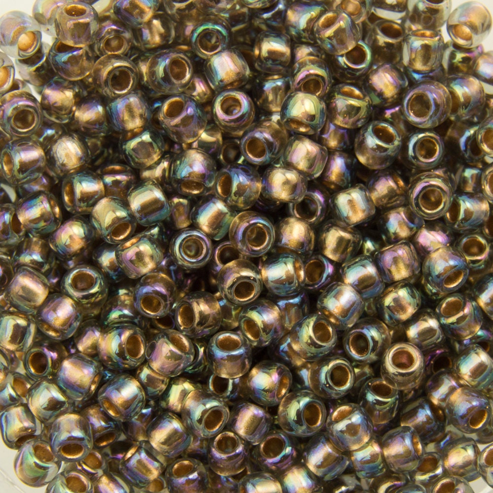 11/0 TOHO ROUND Gold Lined Rainbow Black Diamond Seed Bead (8g)