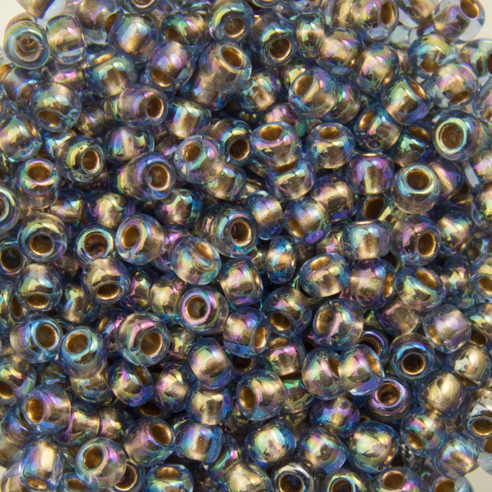 11/0 TOHO ROUND Gold Lined Rainbow Light Sapphire Seed Bead (8g)