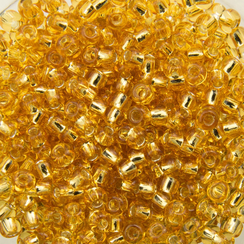 11/0 TOHO ROUND Silver Lined Medium Topaz Seed Bead (8g)
